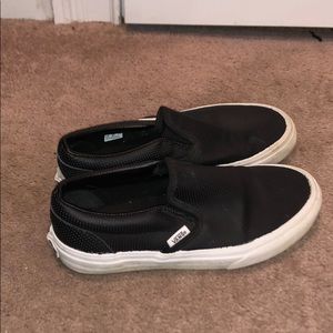 Black leather slip on vans.